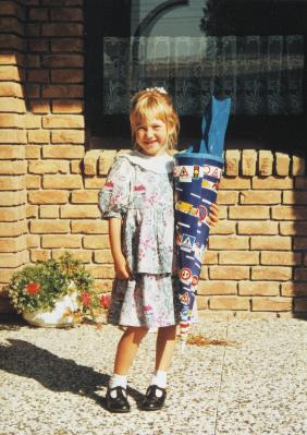 Me on my first day of school. In Germany you get a cone called a Schultüte - a big cardboard cone, prettily decorated and filled with toys, chocolate, candies, school stuff.